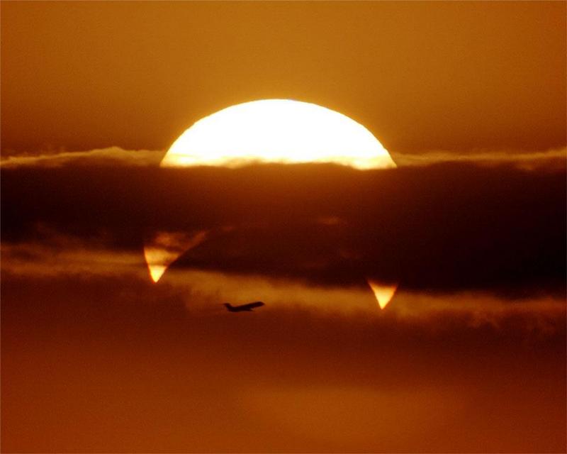 Partial Solar Eclipse with Airplane.jpg